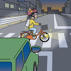 夜の横断歩道をヘルメット着用の自転車がライトをつけて渡ってるところを車のライトが照らしているイラスト